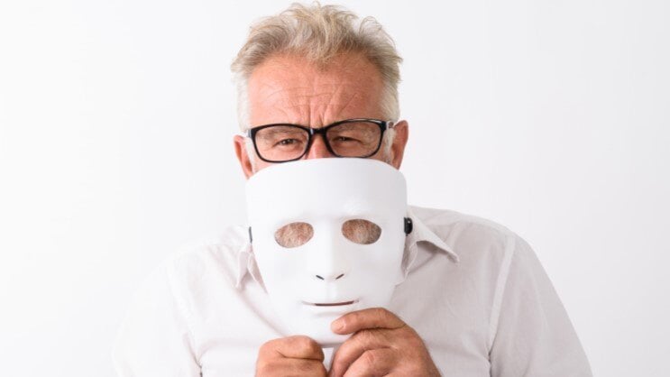 Man peeking over a mask