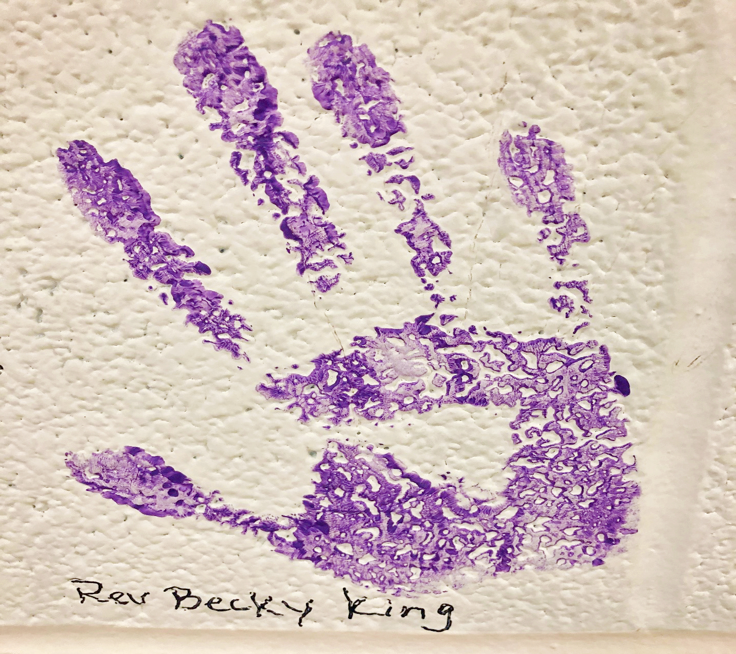 Rev. Becky King's purple handprint