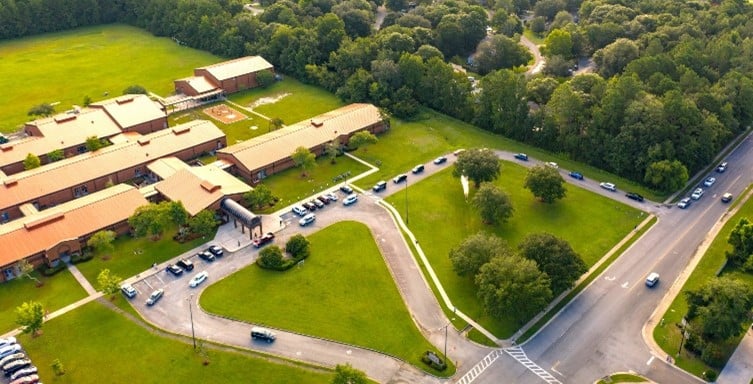 Line of cars waiting to drop off kids at school